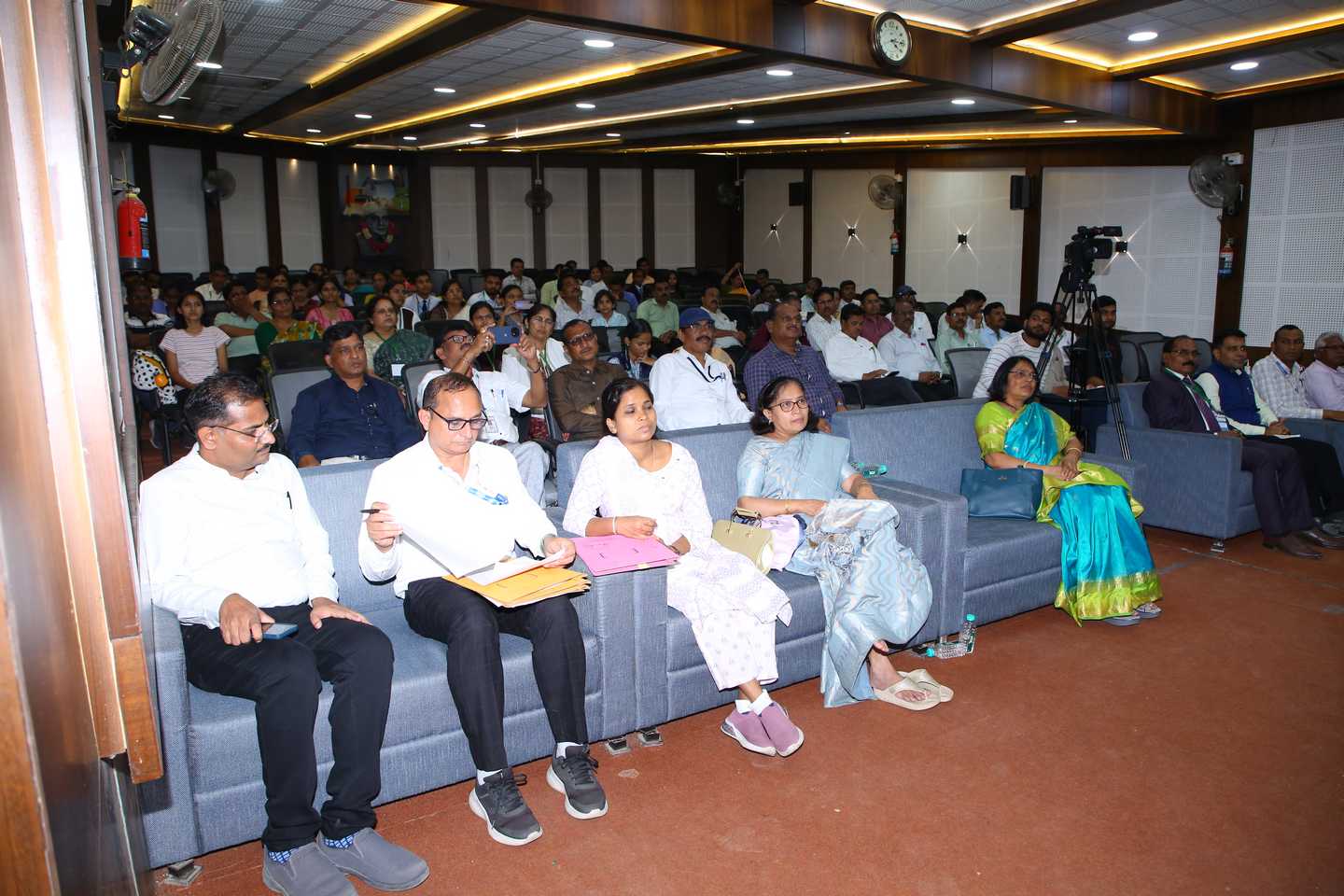 Science teachers, students, and science enthusiasts observing the students