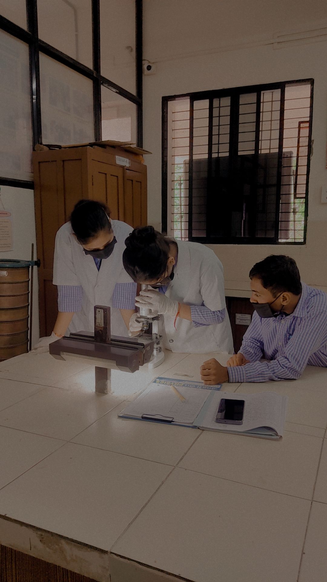 Student observing Slide in Microscope 2