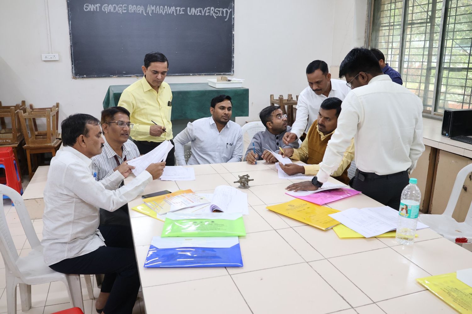 Faculty members discussing on syllabus framing