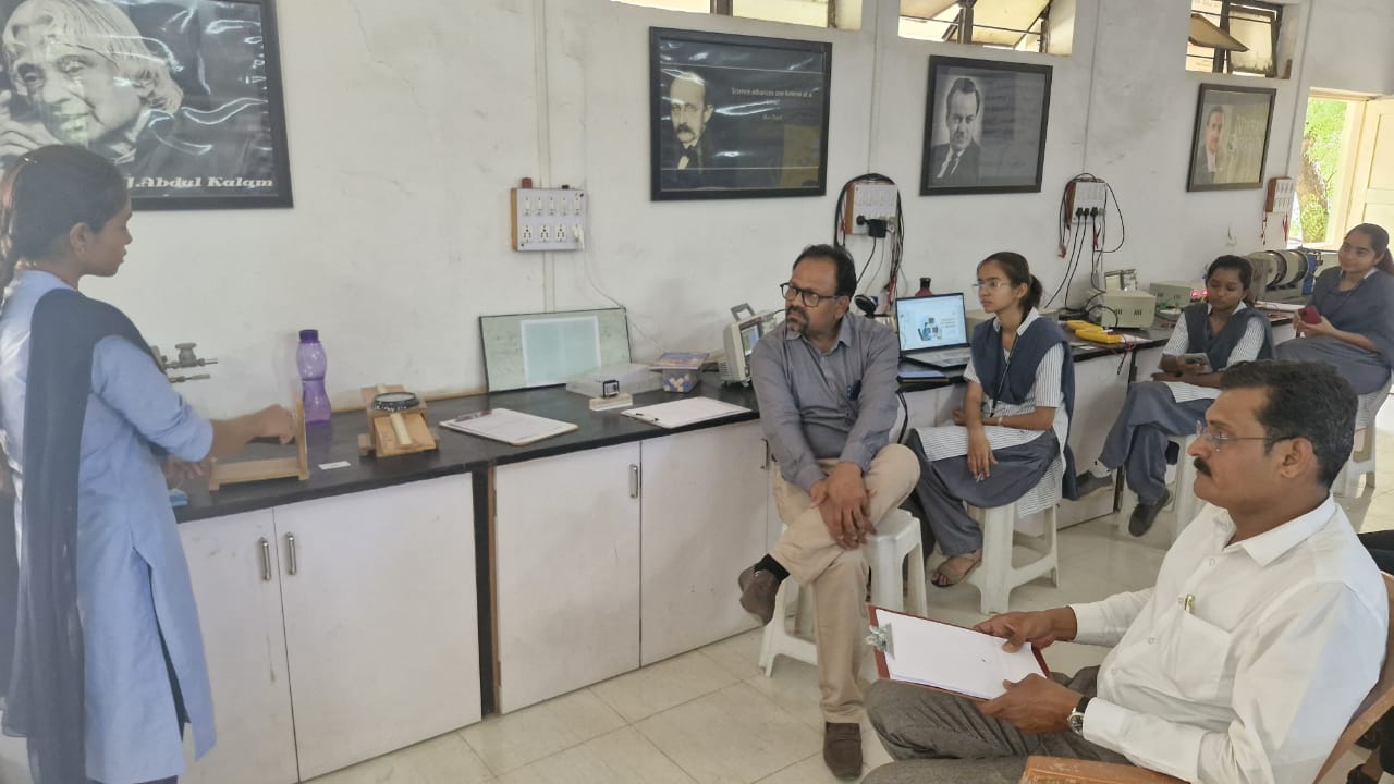 Student Demonstrating her experiment to Jury Member