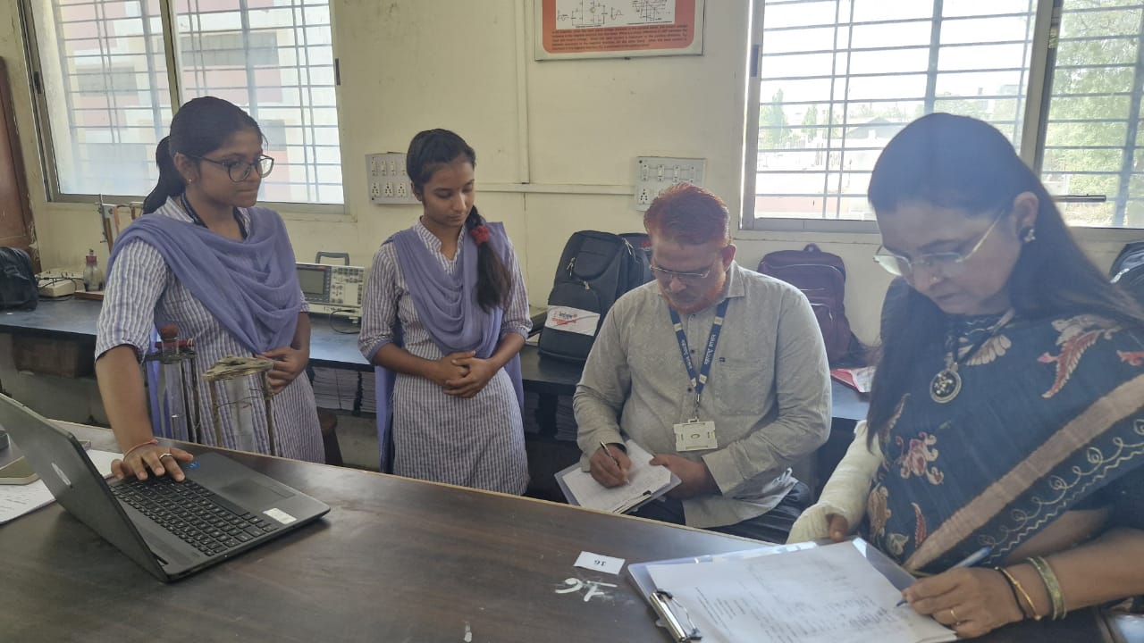 Student Demonstrating her experiment to Jury Member