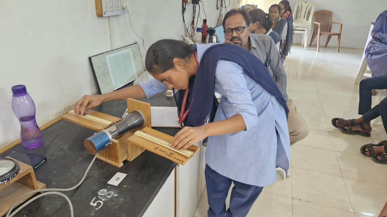 Student Demonstrating her experiment to Jury Member